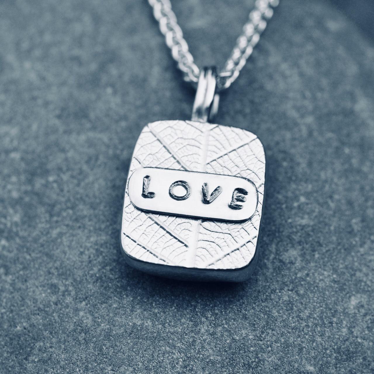 Malachite 'Love' silver pendant on silver chain